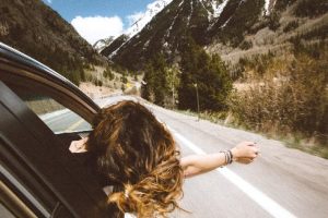 Woman in car - Photo by averie woodard on Unsplash