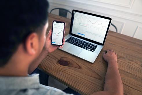 Man with mobile and laptop - Photo by Joshua Mayo on Unsplash