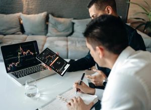 Traders analyzing graphs - Photo by AlphaTradeZone on Pexels