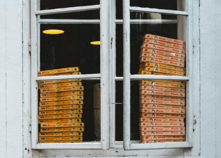 Pizza boxes - Photo by Thomas Peham on Unsplash